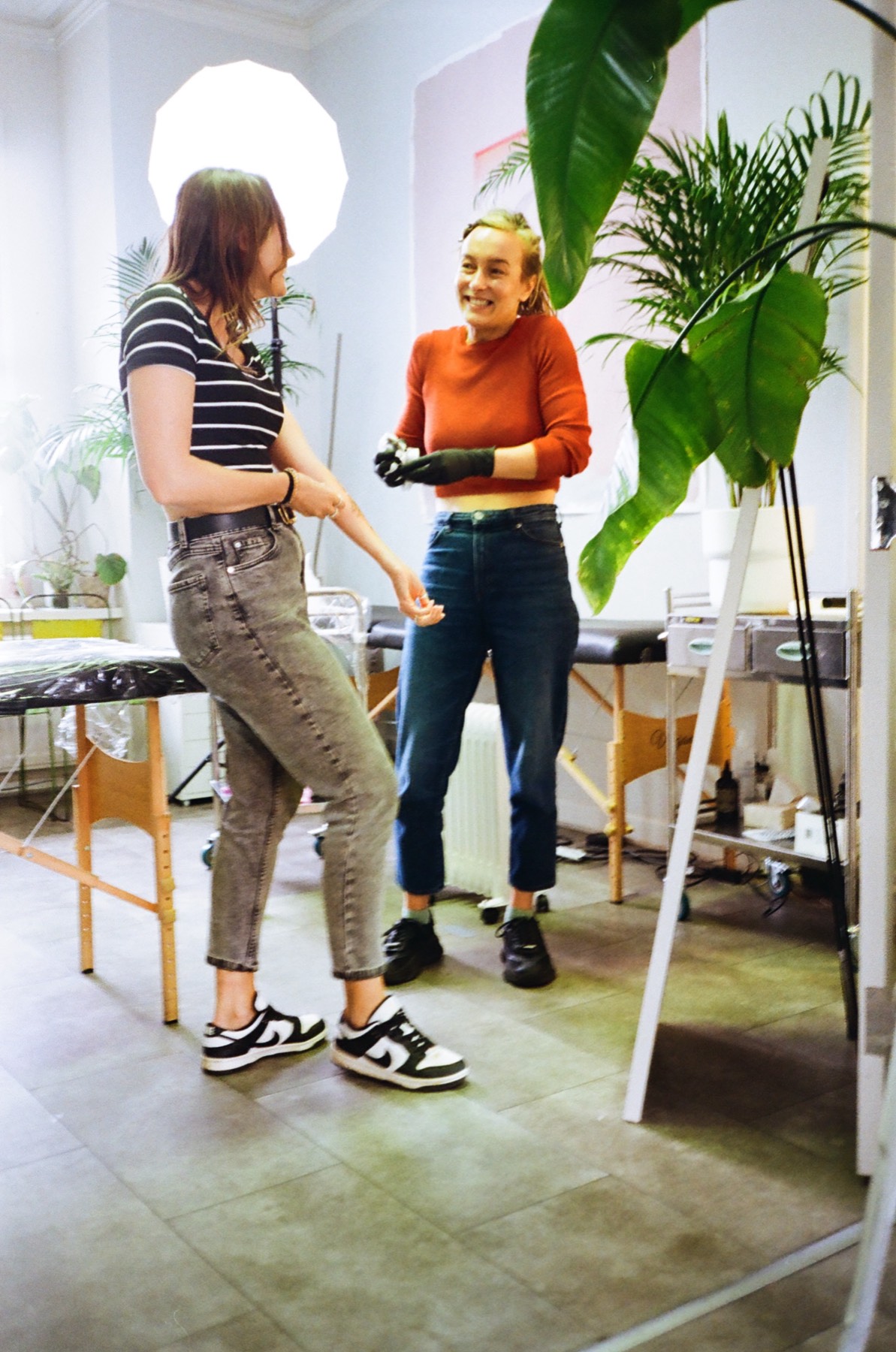 Gosia laughing with a client in her Clifton, Bristol studio